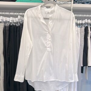 Half button down, crisp white shirt from luxury Italian designer.